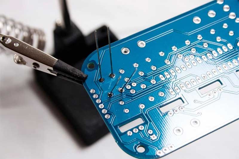Spread leads on back of PCB to hold resistors in place
